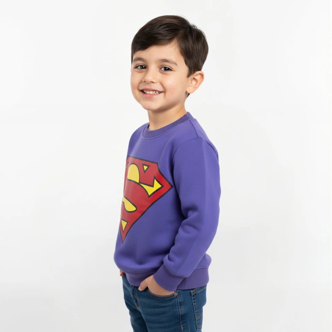 Child wearing a purple sweatshirt with a Superman logo on a white background