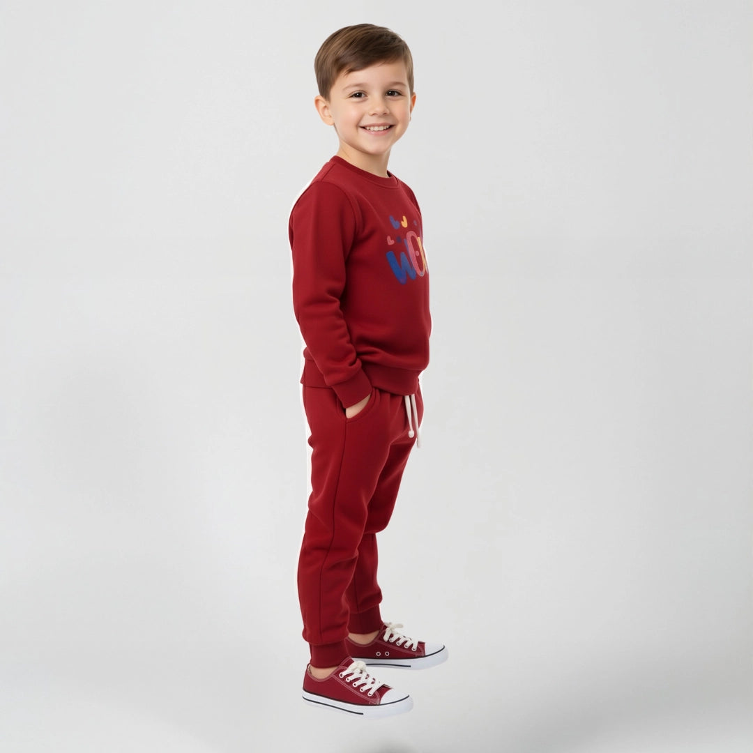 Boy wearing red fleece two piece set, wow written on it